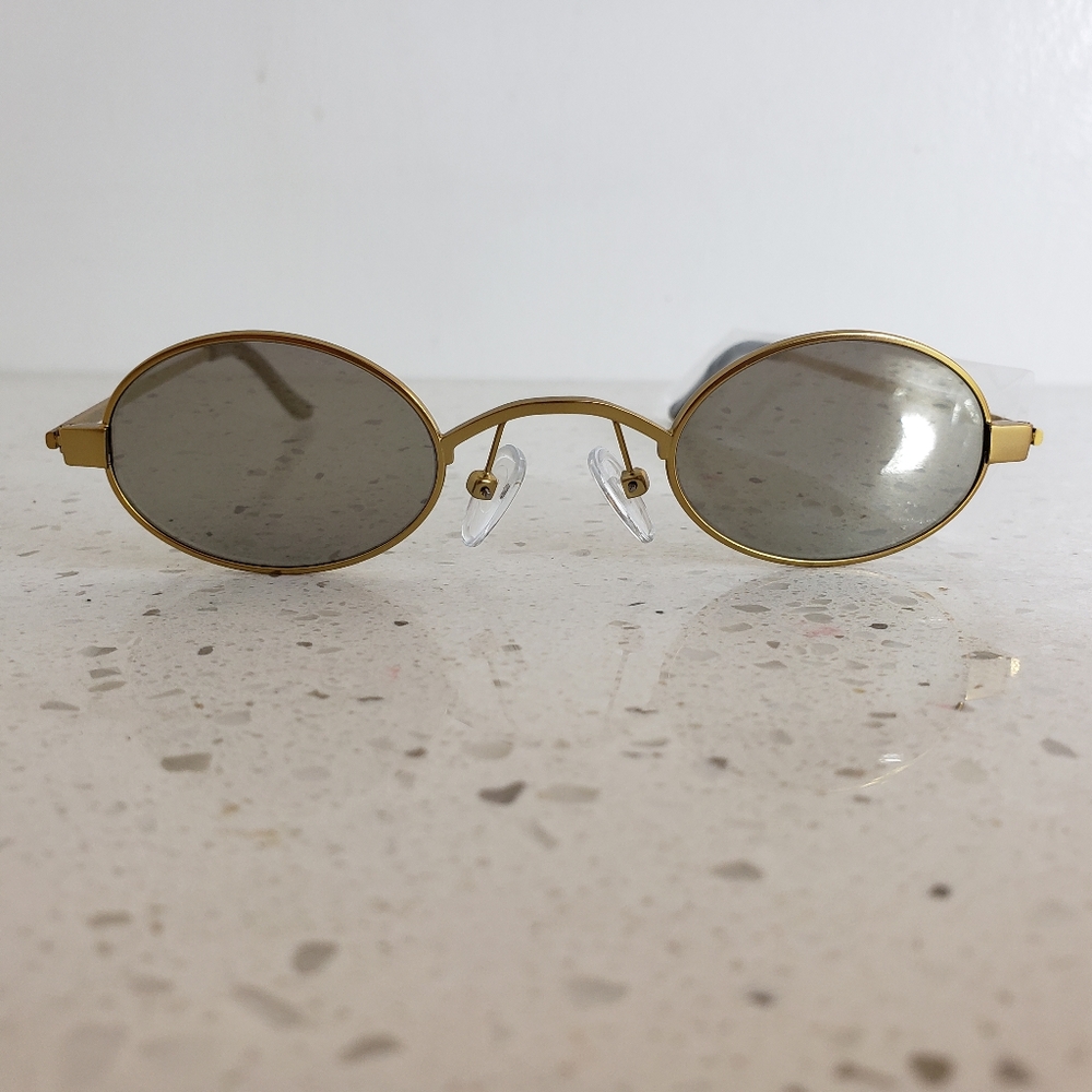 Small frame gold sunglasses